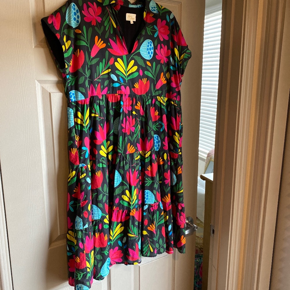 A bright colored, loose footing dress